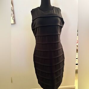 Women’s black fitted Calvin Klein dress size 12. Back Zipper.